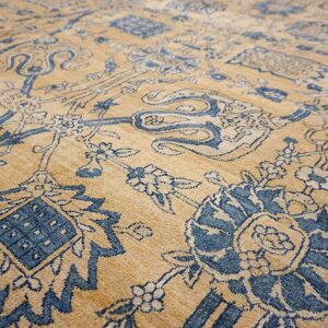 Close-up of a tan and blue floral patterned rug by Rugs On Net. by Rugs On Net