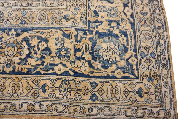 Close-up of a beige and navy blue traditional rug border detail by rugs on net