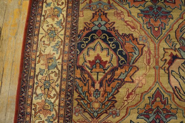 Close-up of an ornate oriental rug pattern featuring gold, red, and blue motifs by rugs on net