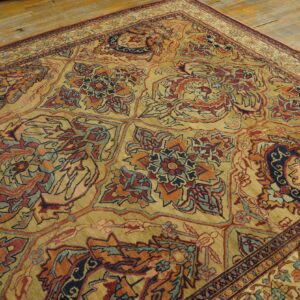Close-up of an ornate, traditional rug with gold, red, and blue patterns by Rugs On Net