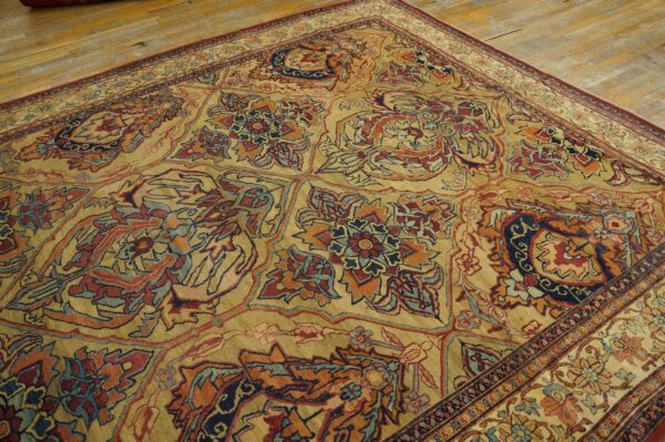 Close-up of an ornate, traditional rug with gold, red, and blue patterns by rugs on net