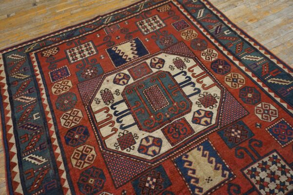 Close-up of a vibrant red and blue geometric rug design by rugs on net. By rugs on net
