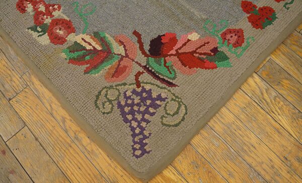 Close-up of a hooked rug corner featuring grapes and berries on a tan field, by rugs on net