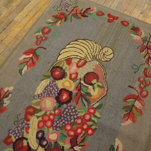 A colorful hooked rug featuring a cornucopia overflowing with fruit and flowers on a gray field, by Rugs On Net. by Rugs On Net