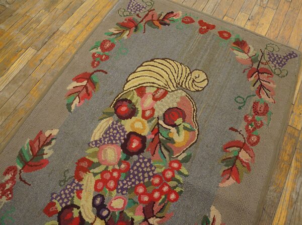 A colorful hooked rug featuring a cornucopia overflowing with fruit and flowers on a gray field, by rugs on net. By rugs on net