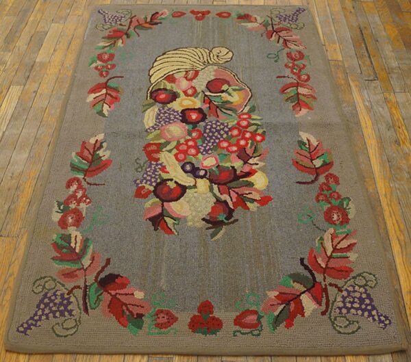 Hooked rug featuring a central fruit arrangement framed by autumn leaves and grapes, by rugs on net