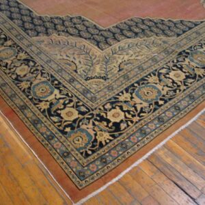 Close-up of an ornate Persian rug border with navy and gold detailing by Rugs On Net