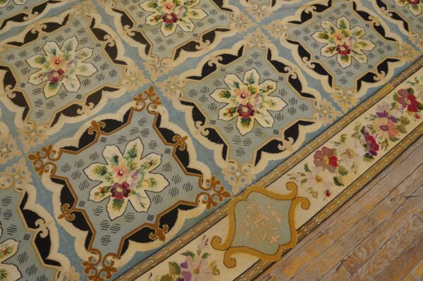Close-up of a needlepoint rug with blue field and floral medallions by rugs on net