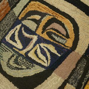 Close-up of an abstract, colorful hooked rug design on a wood floor by Rugs On Net. by Rugs On Net