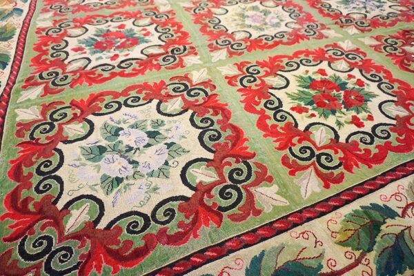 Close-up of a vibrant green and red floral tapestry rug by rugs on net. By rugs on net