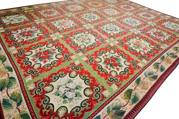 Close-up of a green and red floral rug design by rugs on net. By rugs on net