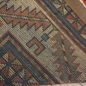 Close-up of the intricate weave and geometric patterns of the Kilim rug by Rugs On Net. by Rugs On Net