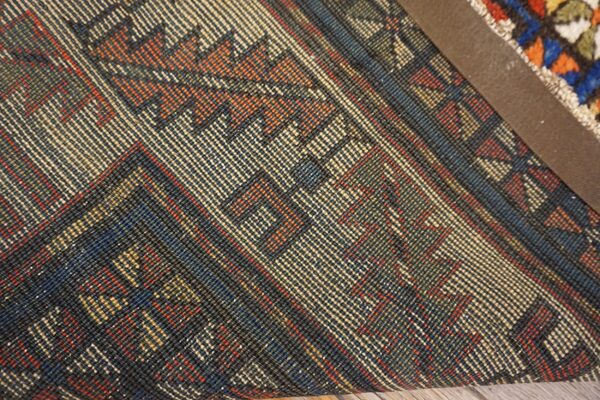 Close-up of the intricate weave and geometric patterns of the kilim rug by rugs on net. By rugs on net