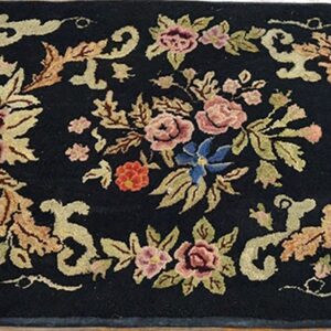 Black rug with pink, blue, and gold floral design, by Rugs On Net
