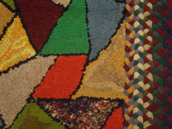 Close-up of a colorful geometric rag rug pattern by rugs on net. By rugs on net