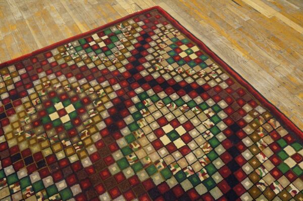 Close-up of a colorful, geometric rug with square patterns on a wooden floor by rugs on net