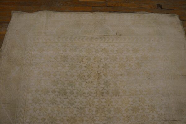 Close-up of a light beige, subtly patterned rug detail by rugs on net. By rugs on net