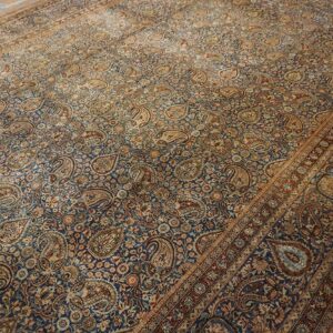 Close-up of a blue and tan Paisley design rug by Rugs On Net. by Rugs On Net