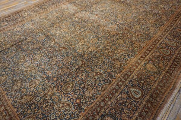 Close-up of a blue and tan paisley design rug by rugs on net. By rugs on net