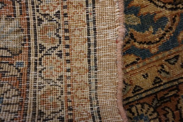 Close-up showing the weave and edge of a traditional persian rug by rugs on net. By rugs on net