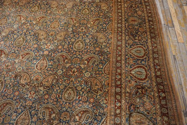 Close-up of a blue persian rug featuring intricate paisley and floral patterns by rugs on net. By rugs on net