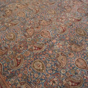 Close-up view of a blue field rug with intricate paisley and floral patterns, by Rugs On Net