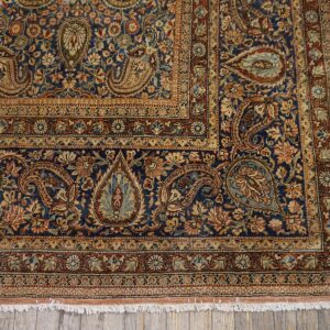 Close-up corner detail of a blue Persian rug with intricate paisley and floral borders by Rugs On Net. by Rugs On Net