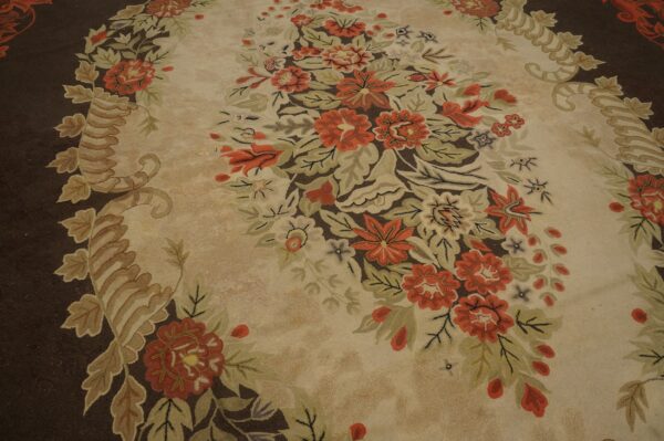 Close-up of a floral rug with orange and green motifs on a beige field, by rugs on net
