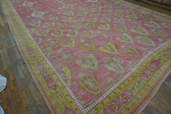 Close-up of a pink and yellow patterned rug, possibly a persian or oriental style, by rugs on net