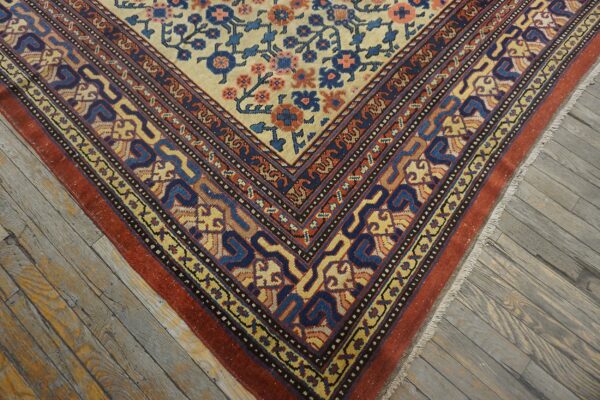 Close-up corner detail of a traditional rug with ivory field and geometric borders, by rugs on net