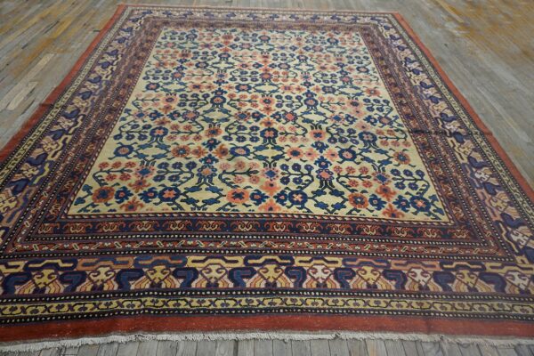 Close-up view of a traditional floral rug with cream, blue, and coral accents by rugs on net. By rugs on net