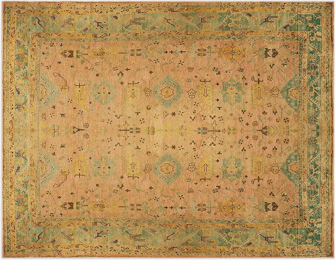 Large oversized soft coral filed antique large scale tribal arts and crafts pattern turkish oushak rug