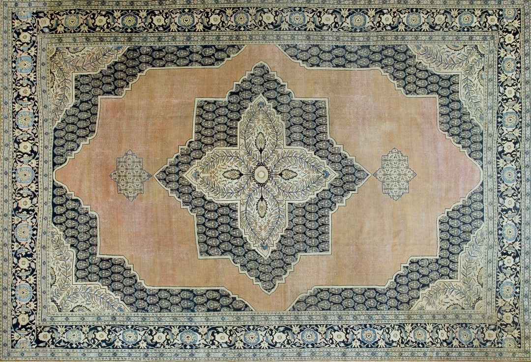 Fine antique late 19th century large classic paisley persian open field medallion tabriz rug