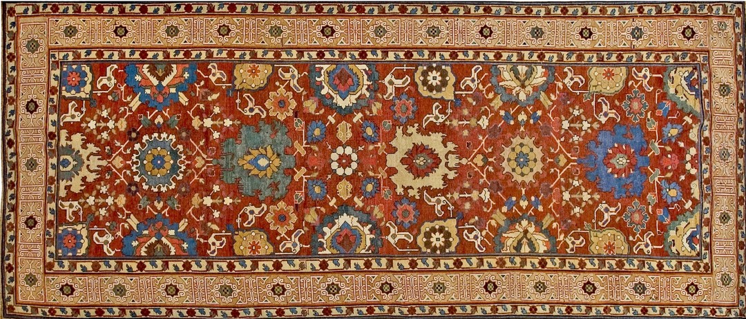 Large scale tribal rustic antique early 19th century long and narrow caucasian kuba kufic border rug