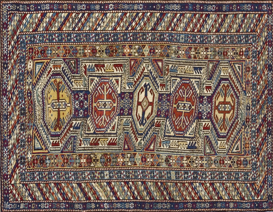 Small colorful antique late 19th century tribal geometric key hole design caucasian shirvan rug