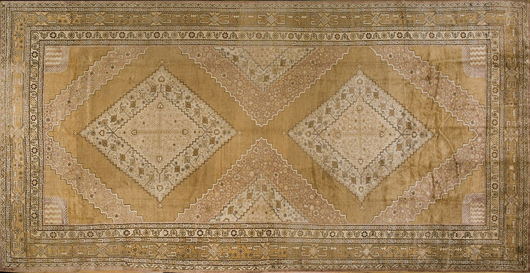 Large long and narrow size antique east turkestan neutral cream color khotan coral rug