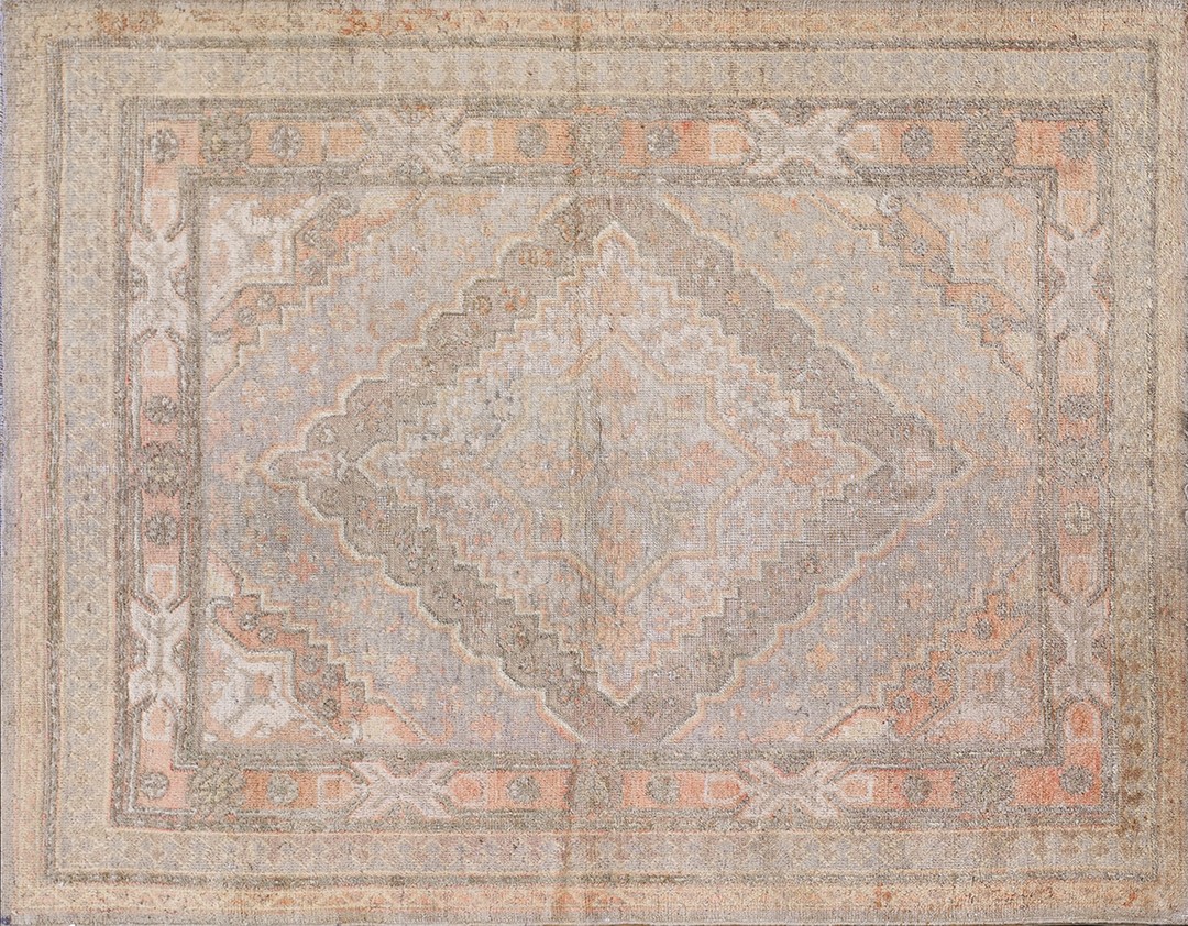 Antique soft light faded color geometric medallion hand knotted pile khotan rug