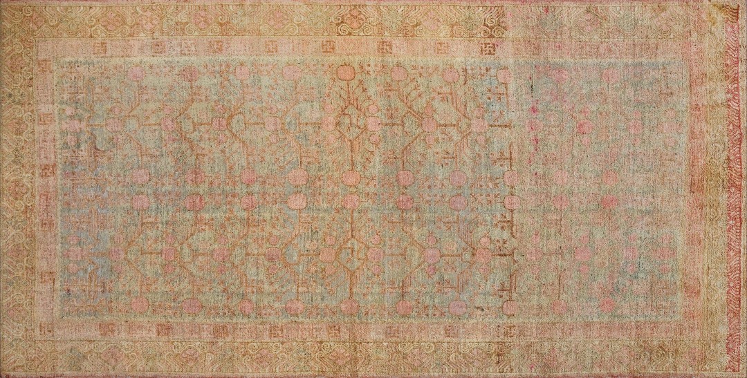 Light washed out color antique east turkestan pomegranate design khotan rug