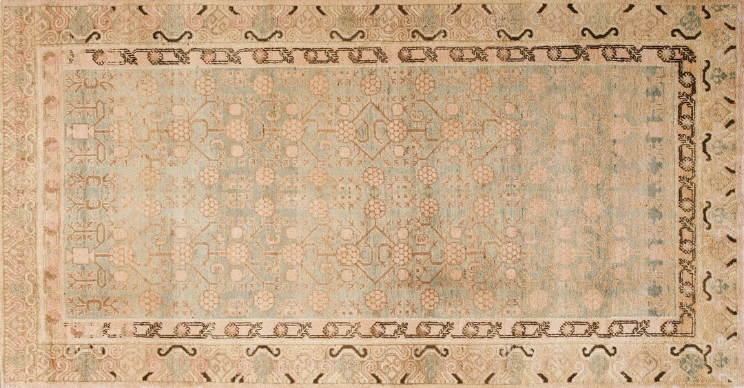 Antique khotan east turkestan allover pomegranate design hand knotted pile rug