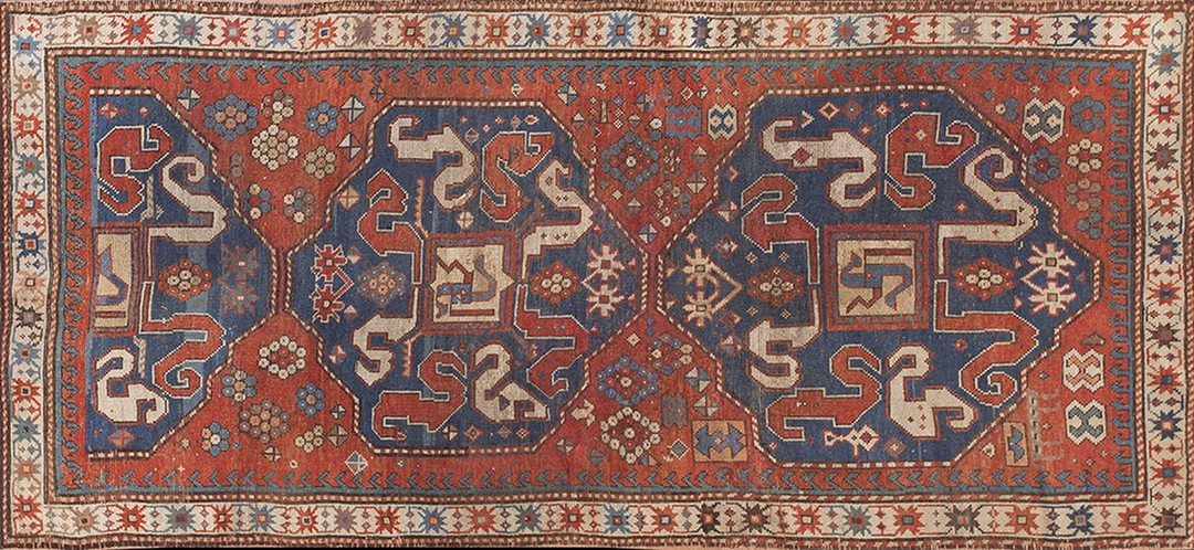 Red and blue antique wool pile tribal caucasian kazak rug