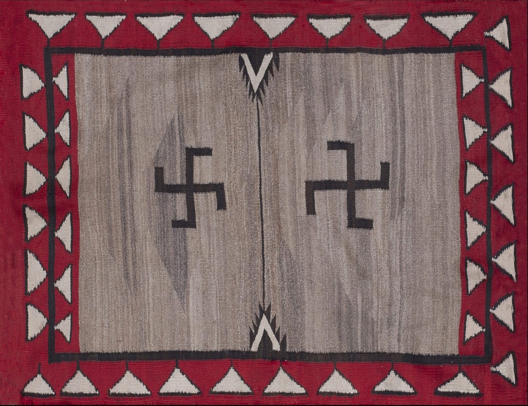 Classic tribal antique native american swastika design flat weave navajo rug