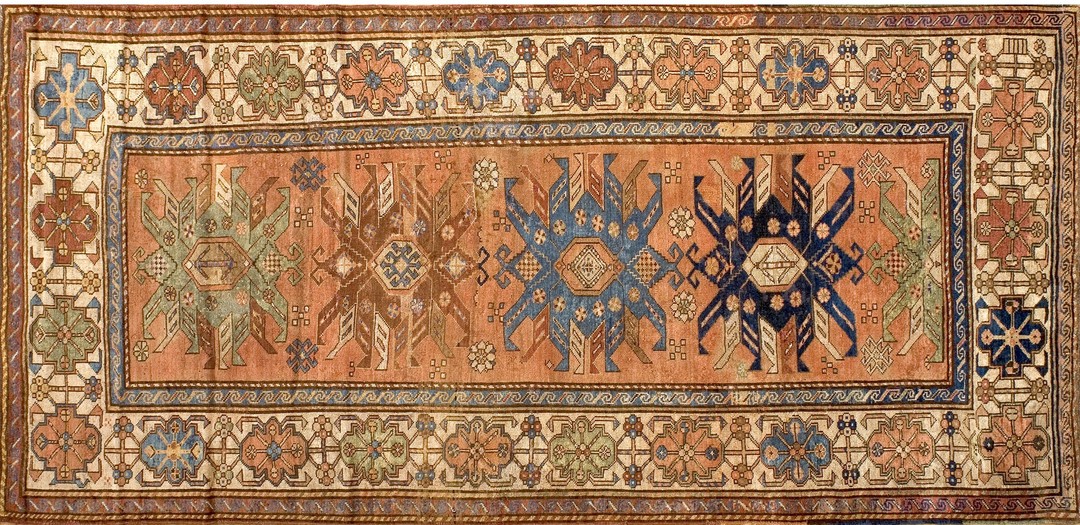 Tribal antique warm coral color wool caucasian shirvan rug