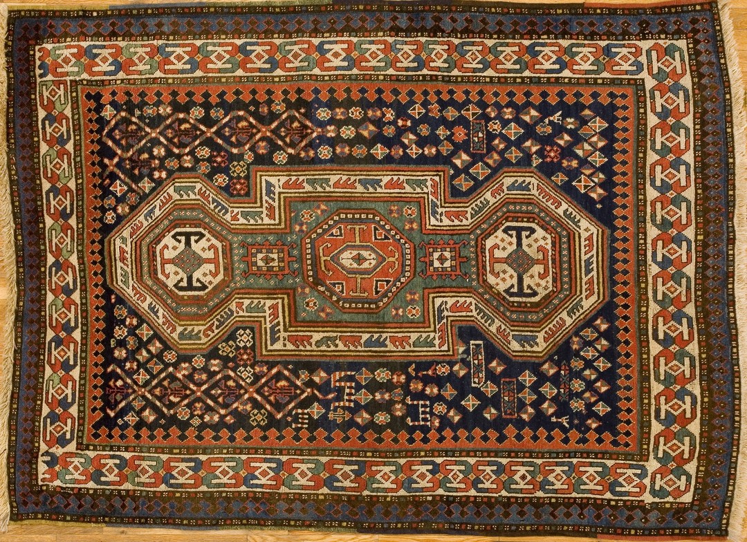 Hand knotted wool pile antique caucasian tribal geometric keyhole design rug