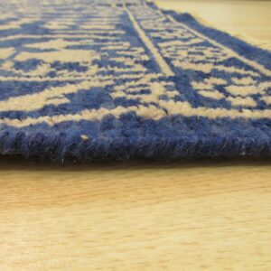 Blue floral rug with brown chair