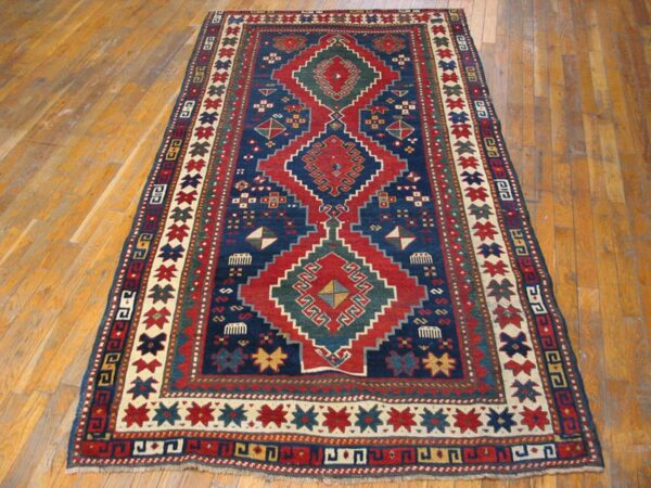 Antique caucasian kazak rug 4'×7'7" blue medallion design, 1890s 2 Antique caucasian kazak rug 4'×7'7" blue medallion design, 1890s - detail view 1