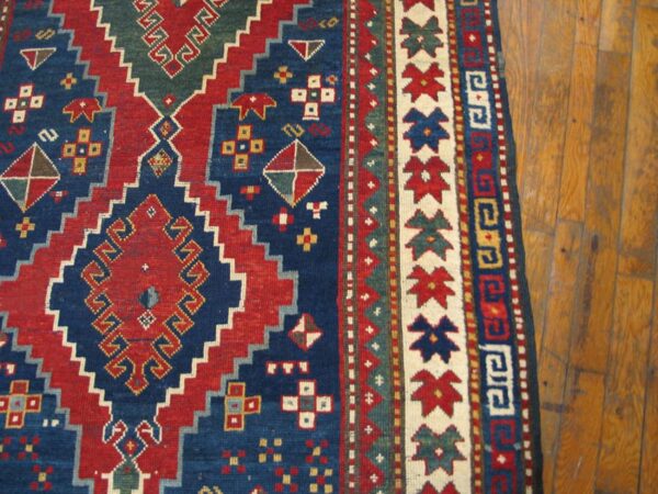 Antique caucasian kazak rug 4'×7'7" blue medallion design, 1890s 4 Antique caucasian kazak rug 4'×7'7" blue medallion design, 1890s - detail view 3