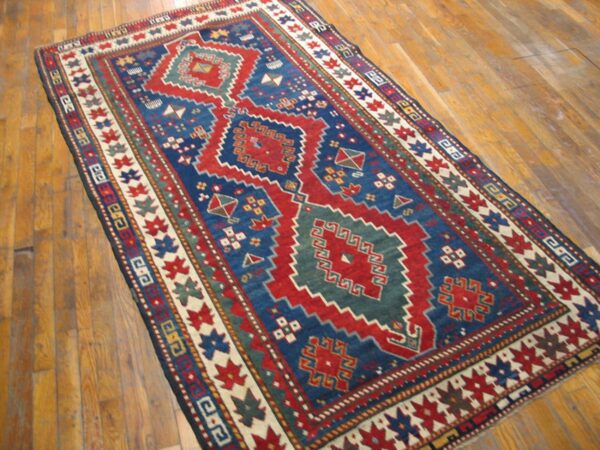 Antique caucasian kazak rug 4'×7'7" blue medallion design, 1890s 5 Antique caucasian kazak rug 4'×7'7" blue medallion design, 1890s - detail view 4