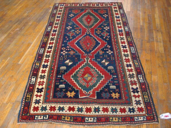 Antique caucasian kazak rug 4'×7'7" blue medallion design, 1890s 8 Antique caucasian kazak rug 4'×7'7" blue medallion design, 1890s - detail view 7