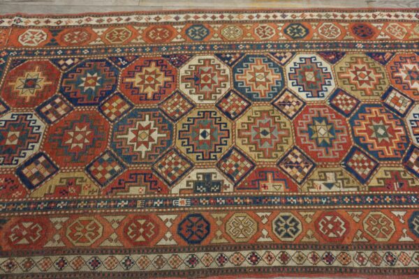 Antique caucasian kazak rug 4'×8'2" multi geometric, rose pink border, circa 1890 7 Antique caucasian kazak rug 4'×8'2" multi geometric, rose pink border, circa 1890 - detail view 6