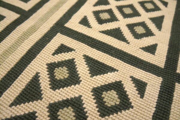 Contemporary handwoven wool needlepoint rug â€” beige ground, diamond pattern - detail view 5
